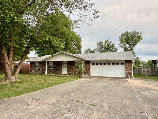 Fantastic convenient location to I-49, schools and shopping!! Newer roof. Spacious home with an open floor plan. Wood burning, brick fireplace, 3 bedrooms, 2 baths, Spacious laundry/mud room, it has both front and back porches and a nice ‘potting shed” in the large partially fenced backyard.