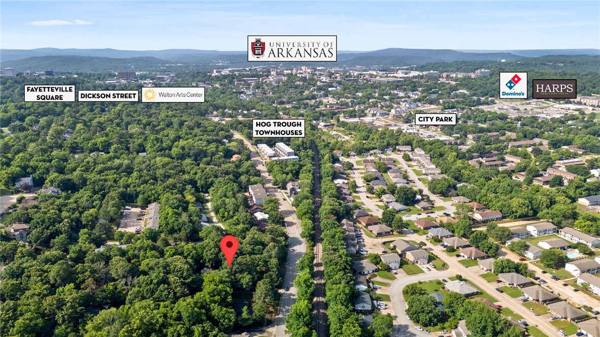 Rare redevelopment opportunity near the University of Arkansas! Surrounded by established residential neighborhoods, multifamily projects, & strong area amenities. This lot is well positioned to capitalize on Fayetteville's continued growth & demand for quality housing. All utilities on site; existing home holds no value. Ideal for residential or multifamily developments. Minutes from the University of Arkansas and Washington Regional Medical Center. Close proximity to retail, dining, schools, medical services, public transit, & walking/biking trails. Easy access to N College Ave, Dickson St, & I-49.