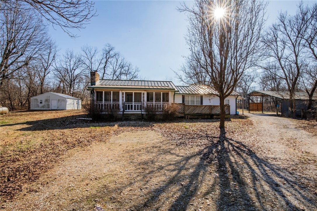 Located in the heart of Northwest Arkansas this property has all kinds of potential.  Easy access to I-49.  The property consists of 20 (+/-) acres.  Would make a nice estate property or could be developed into estate lots.  Lots of privacy and room to spread out.  The value is in the land.  There is currently an older farm house on the property along with two shops and a pole barn.  There is a well on the property.  The property is in the city limits of Springdale with a Lowell mailing address.  Rogers School District.