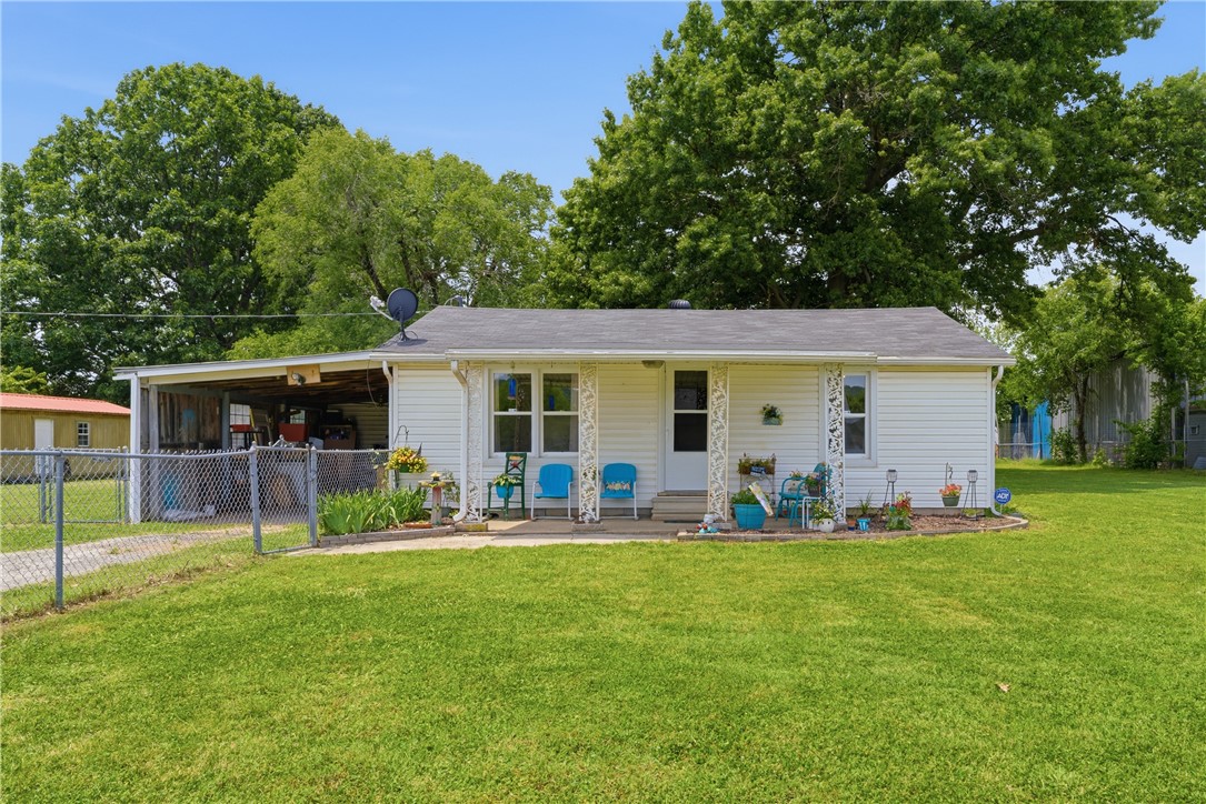 Charming 2-bedroom, 1-bath home situated on nearly 1 acre in Springdale. Inside, you'll find a comfortable layout featuring a spacious living area, a functional kitchen with ample cabinet and counter space, and a versatile area that can be used as a home office, hobby room or additional living space. Step outside to enjoy the expansive yard and a large detached shop that offers plenty of room for storage, projects, equipment, or a workshop. With plenty of outdoor space and endless possibilities, this property combines convenience and flexibility. Ideally located near shopping, dining, schools, parks, and everyday amenities, with easy access to major roads and Northwest Arkansas destinations. A great opportunity for homeowners, investors, or anyone looking for extra space in a convenient Springdale location.