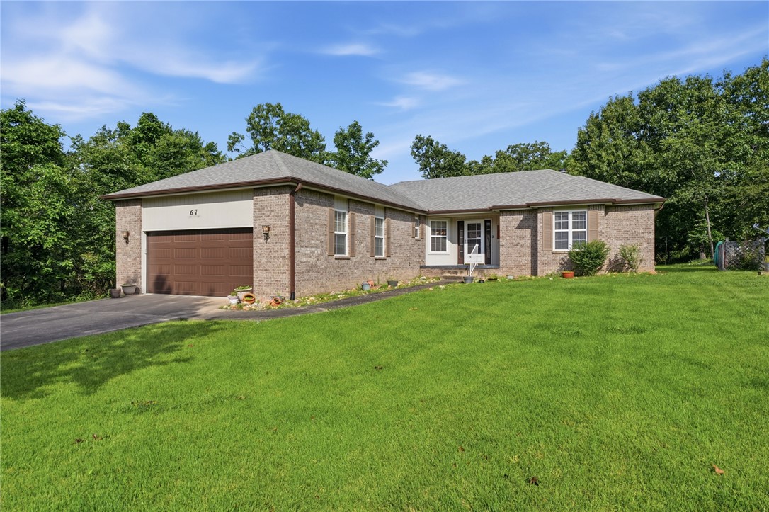 Look no further! This well-maintained home has a split bedroom plan, large living room with vaulted ceilings, gas log fireplace, sunroom, big deck, oversized 2 car garage, and landscaped yard. Primary bedroom has 2 closets leading into primary bathroom which has double vanities, whirlpool tub and walk-in shower. This home is located just 2 minutes from Brachwood Recreational facility with indoor swimming pool, exercise room, sauna, racquetball, pickleball and walking trails! Enjoy the peace & quiet of the Highland's area with access to Lake Loch Lomond, Highlands & Scottsdale golf courses and more. So much to love!