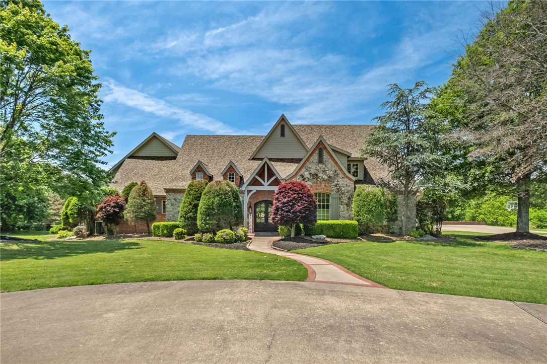 Nestled on +/- 5 private acres in the desirable Talamore Subdivision, this impressive estate features a +/- 9,488 SF home plus a +/- 440 SF pool house. The home offers 6 beds, 5 full baths, and 3 half baths across three levels, including a full basement. Highlights include 4 fireplaces, vaulted wood ceilings, plantation shutters, and a spacious primary suite with his and hers closets and a hidden safe room. The chef's kitchen features custom cabinetry, a built-in sliding refrigerator, and JennAir Range. Entertain with ease at the wet bar with coffered ceiling, a separate pantry, ice maker, dishwasher, and sink. A stunning stone wine cellar holds +/- 360 bottles with additional space for case storage and dedicated refrigerator. Flexible bonus rooms provide space for a gym, game rooms, or media room. Outside, enjoy a private in-ground pool, pool house, and outdoor fireplace. The property also includes an oversized detached garage with storage below. Residents enjoy access to the community fishing pond.
