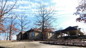 You'll instantly fall in love with this secluded mountain getaway! Perfectly situated on top of a hill on 17.84 acres at the base of Mt. Nebo. The exterior is made entirely of Arkansas Ledge Stone and looks like it should be in a magazine...and what a view! This home is so warm and unique, you'll have to see it for yourself. Everything is tasteful from the gorgeous flagstone floors to the vaulted wood ceilings. Granite counters and warm wood cabinetry make for a stylish and cozy kitchen. 4 large bedrooms each have their own generous sized baths and the rec room is centrally located and very versatile. This is your dream home!