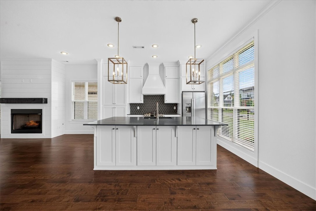 Some homes simply make everyday life easier. Whether you're enjoying coffee on the covered patio beside the outdoor fireplace on a quiet morning, hosting friends for dinner, or gathering around the kitchen island after a long day, this home was designed for the moments that matter most.

Life extends well beyond your front door in Aurora. Spend summer afternoons at the neighborhood pools, meet friends for a game of pickleball, gather at the clubhouse or picnic area for celebrations, enjoy the playground, let your four-legged companions run at the dog park, or simply take an evening stroll through a neighborhood designed to bring neighbors together.

Just minutes from shopping, dining, top-rated schools, and everything Northwest Arkansas has to offer, you'll spend less time commuting and more time enjoying home. Thoughtfully maintained and move-in ready, this isn't just a house, it's a place to slow down, gather with the people who matter most, & create lasting memories. Your next chapter can begin from day one.
