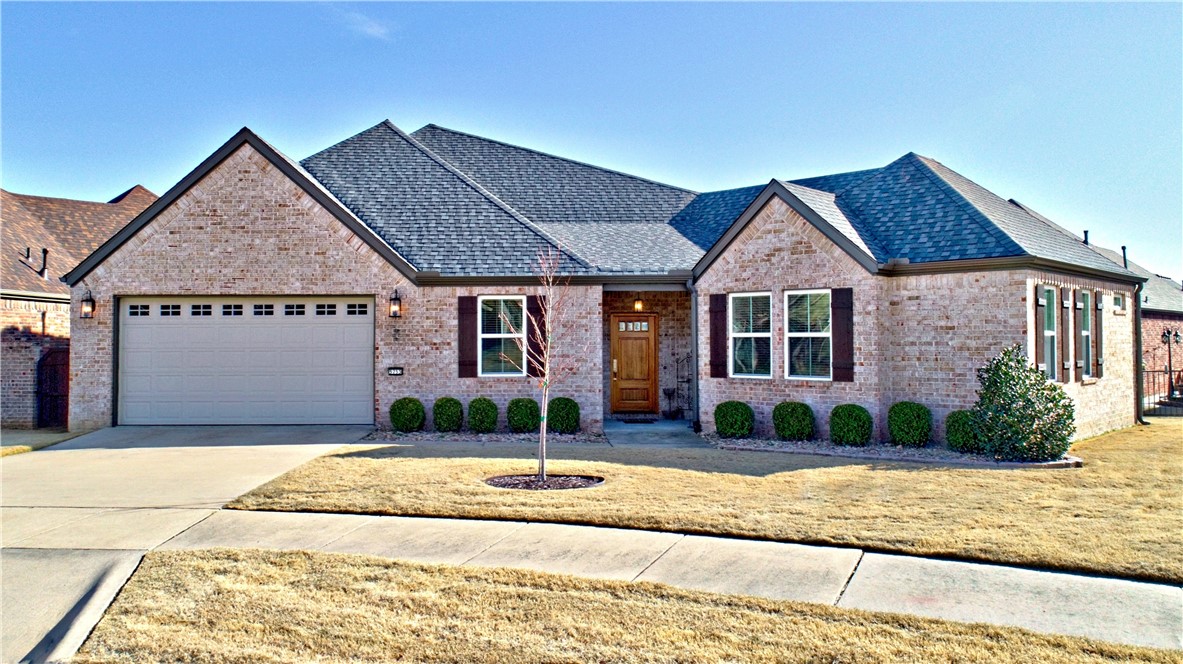 OWNER IS READY TO SELL THIS BEAUTIFUL HOME/NEW PRICE/ 3 Bedrooms/2 Bath brick designer home in mint condition and move-in ready.  Located in 55 & Older Community/Beautiful Club House and lots of activities for residents in desirable VICENZA VILLAS Subdivision with lake and fountains and trails. This home offers it all....Best home location in the community/ Great Floor Plan with lots of Light & updated features/ beautiful Wood Floors, Granite Counters, Large Walk-in Shower/Large beautiful Fireplace with Gas Logs, Built-in China Cabinet & Large Covered Patio for entertaining. This beautiful home is surrounded on 2 sides with lovely Green Landscaped Common Areas.  Also included is New Roof, New Gutters,& New Shutters (2025) This home is well loved and impeccably clean.  The refrigerator conveys, and the quest bedroom furniture (almost new) conveys with a full price offer.This is a very desirable location close to all amenities-restaurants, shopping, hospital and parks.Close to everything that is Northwest Arkansas.