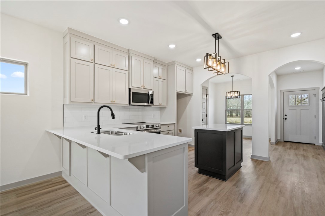 Second chance at this beautiful home! This home is back on the market at no fault of the seller, inspections/appraisal were completed successfully. This quality new construction brings modern luxury living with elegant custom finishes! This brand-new 4 bedroom, 2 1/2 bath, 1809 sq ft home is built by a custom home builder known for exceptional attention to detail. Meticulously crafted details include custom cabinetry, quartz countertops, sophisticated lighting finishes, LED lighting, stylish fireplace with oak mantle, stainless steel appliances, large bedrooms, ample amounts of storage, walk-in-closets and a well-designed floor plan that elevate both style and functionality. Enjoy peaceful mornings or evenings on the covered back porch with a fully sodded and fenced yard creating a great outdoor space ready for your personal touch. All on a low traffic street across from a peaceful open field and close to school making this home a standout choice!