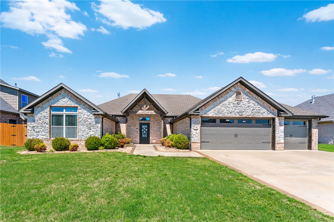 Welcome home to this modern ranch with Craftsman influences—this 4BR/2.5BA one-level home sits in a prime Centerton location, walking distance to Bentonville West High School and Gamble Elementary School and just minutes to Bentonville. The thoughtfully designed layout offers an open, airy feel with LED and mood lighting throughout, hardwood in high-traffic areas, and a chef-ready kitchen featuring custom soft-close cabinetry and a hidden walk-in pantry. The primary suite connects directly to the utility room for everyday efficiency, while upgrades like tankless hot water, central vac, Energy Star appliances, security system, and privacy fencing add long-term value. Positioned near the future Centerton downtown expansion, this home delivers both modern convenience and strong growth potential.
