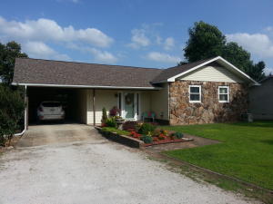 Beautiful and ready to move in! This three bedroom 1 1/2 bath, home has been recently renovated and is immaculate! New roof in 2013, new wood, and tile flooring, bathrooms updated, nice covered and open decks. Storage/ shop space, and unfinished basement. All this place needs is a new owner!
