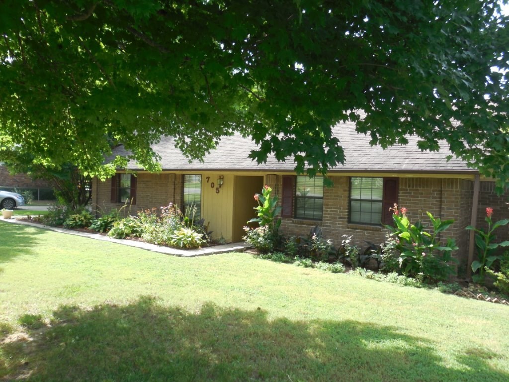 Well-built home with 6 inch walls, nicely updated with granite, tile and wood floors through most of the home. Lovely sunroom, large patio for entertaining, garden spot, landscaped and on .40 acre.