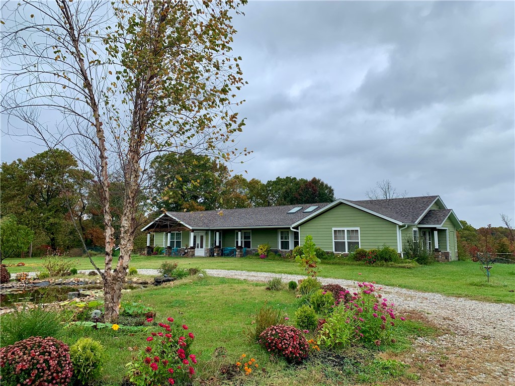 Showing starts June 12 
Amazing location, beautiful house/property/farm just a few minutes from Pea Ridge and Bentonville. Complete remodel in 2019. Great location for a health retreat or to keep your own horses, garden, chickens, camping,   Main house is 3,786 SF and features 4 BR's, 3 Full BA's, 2 Half BA's plus a formal Dining Room, Living Room, Family Room, and Atrium w/skylights.
Separate Guesthouse consists of 2 BR's, 1 Full BA, Living Room, and Kitchen. Property also boasts two horse pastures, a large workshop, full-size greenhouse, pole barn, chicken coop, and 2 medium barns all situated on 15.04 lush acres. Huge Primary Suite with two large walk-in closets and leaded glass French doors lead to private deck. Dining room and breakfast area open to living areas. Custom kitchen w/moveable island, dbl ovens and copper farmhouse sink. Large walk-in pantry. Crown molding in DR & family rooms. Continuous tile throughout house w/carpet and hardwood floors. Schedule your showing today, and make it yours!
