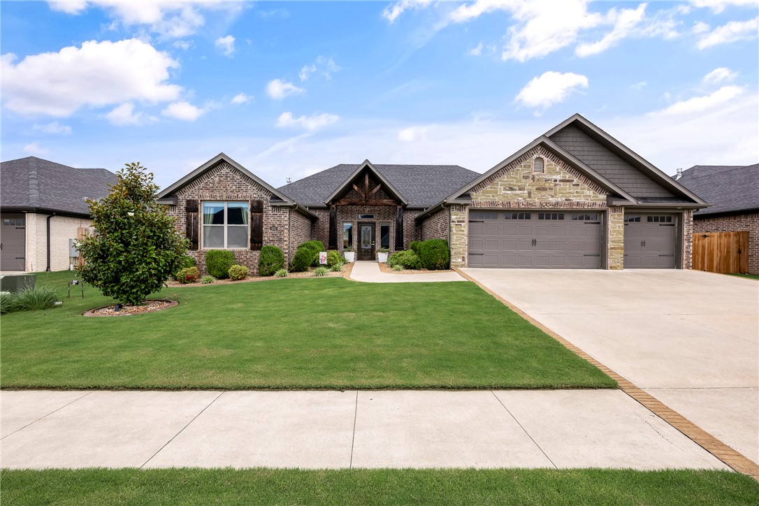 Elegant single-level home by Cornerstone Construction in a prime Centerton location, walking distance to Bentonville West High School and Gamble Elementary. This thoughtfully designed 4-bedroom, 2-bath home features an open floor plan, striking fireplace, chef’s kitchen with oversized hidden pantry, custom soft-close cabinetry, hardwood floors, detailed woodwork, central vac, wired sound, security system, mood lighting, sprinkler system, gas grill hookup, soffit outlets for holiday lighting, professional landscaping, and privacy fencing.