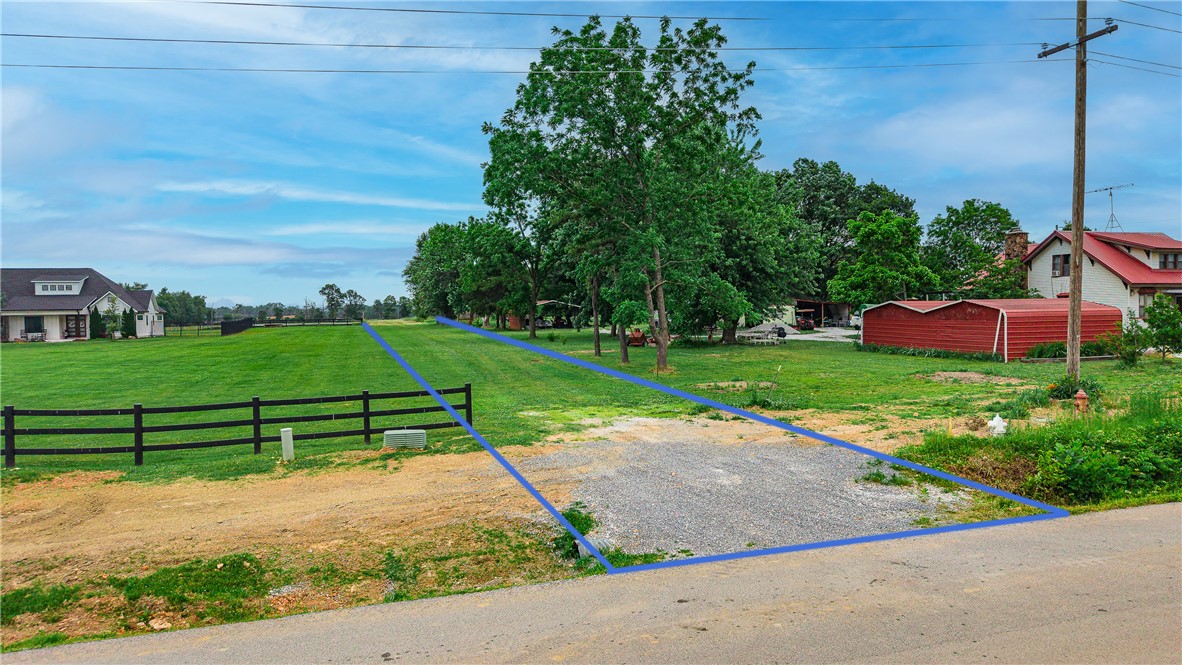 Rare opportunity to own 6.56 level, cleared acres in the heart of NW Arkansas!. The land is level and open — ready for your dream build — with electric, gas, and public water all at the street. This property presents a great opportunity for a family compound or splitting into multiple estate lots. Located in the highly sought-after Bentonville School District and just steps from Bentonville West High School, world-class shopping, dining, Crystal Bridges, and all the amenities that make this region one of the fastest-growing in the nation. Paved road access and no flood zone make this an even easier decision. Don't miss your chance to secure a rare large-acreage lot in one of NW Arkansas's most desirable corridors!
