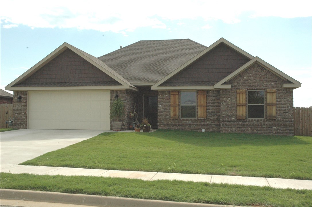 Amazing backyard view with extended back patio. Perfect for your outdoor living space. open floor plan with utility room walk thru to master closet. Custom tiled shower in master shower with corner gas fireplace in living room.