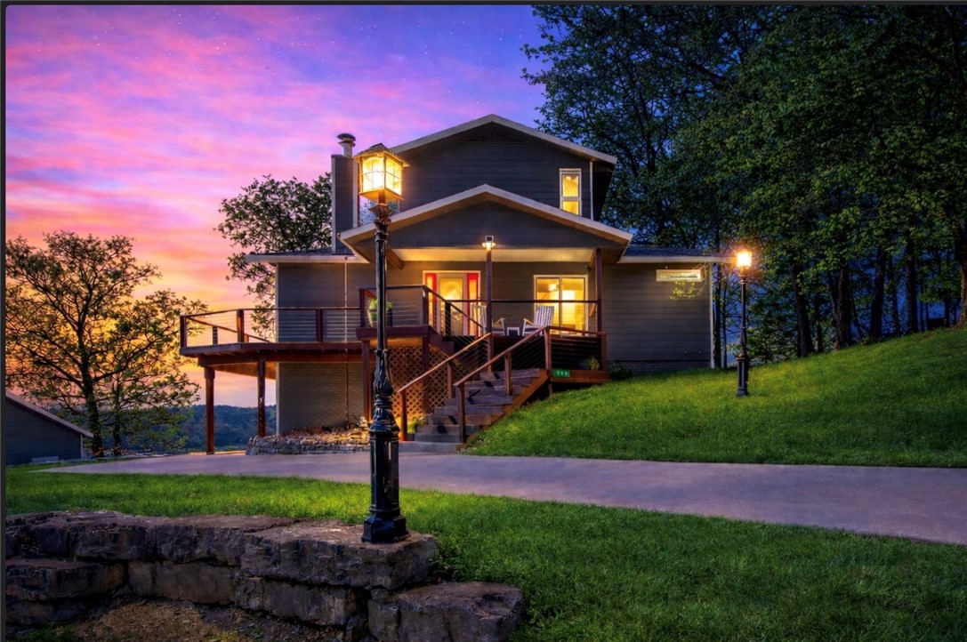 Stunning lakefront property on 3.16 acres offering breathtaking views from an expansive deck and a dramatic wall of windows that brings the outdoors in. The open-concept living, kitchen, and dining area is designed for both comfort and entertaining, featuring a cozy fireplace and seamless flow throughout. The chef’s kitchen is equipped with granite countertops, gas range with griddle, pot filler & wine frig. The primary suite overlooks the lake, providing a peaceful retreat with scenic views. A dedicated office includes a second fireplace and bar, perfect for work or relaxation. Additional highlights include a wine cellar room for enthusiasts and entertainers alike. Located less than one mile from Starkey Marina, this property combines privacy with accessibility. A large 51x41 shop with 2x6 walls, oversized 16x14 door & separate electric meter offers incredible space for hobbies and storage. This rare lakefront retreat blends luxury, functionality & stunning natural surroundings—an exceptional place to call home.”