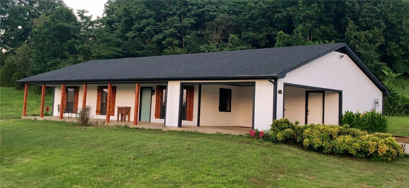 Custom built ranch, nestled on over 5 acres with large covered front porch, carport and great views of the mountains. Central heat and air, utility room and spacious floor plan with large bedrooms and custom built cabinets. Close to Fayetteville, with a country feel. A great place to relax and enjoy life. New roof and freshly painted exterior. All electrical components, HVAC and hot water heater new as of 2010.