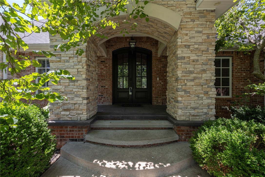 Truly a must-see! Spanning 7,497 sqft (7 bdrm, 7 bath) w/ a 4-car garage on 2 acres backing up to a creek in one of Fayetteville's premier gated communities. Short 6-min drive to shopping & Fayetteville schools! Luxurious primary suite features sitting area w/2-way fireplace & a show-stopping, fully remodeled bathroom & custom walk-in closet. Multiple indoor & outdoor entertaining areas. Kitchen includes dual-function chefs oven, bar sink in island, granite, bar seating, & eat-in leading to sun-filled hearth room. Amazing LL is perfect to host guests for short or long term. HUGE media/game room, large landing opens to in-ground saltwater pool, hot tub (conveys) & fire pit area. Self-contained 2 bed, 2 bath apt w/ own full kitchen, dining, & living room. Perfect for multi-generational living, college students, or MIL suite. 4 car garage includes EV charger, epoxy floors, insulated doors, custom cabinets, & mini-split for comfort. Irrigation, central vac, invisible fence. See complete list of upgrades & improvements.