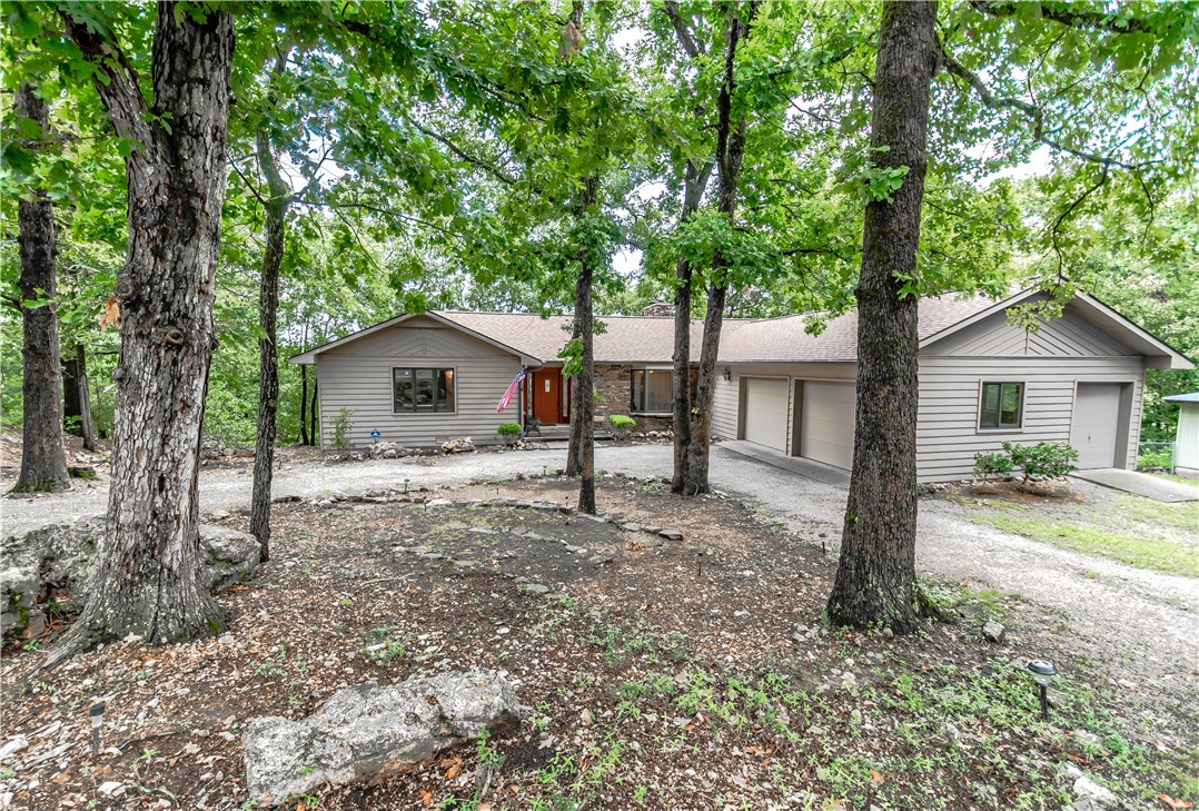 Custom designed home takes in the view w/ample windows on both levels.Main level affords living room,dining,kitchen,utility room,2 bedrooms,2.5 baths, bonus room,deck,screened sunroom & private deck for bbq.Lower level(Additional 1108 sq ft of HVAC) has 1bedroom,bonus room w/2 large windows workshop area w/view &exterior door.Some amenities include:wood burning fireplace w/rock in living room, jetted tub, double sinks & walk in shower in master,wood stove in lower level,2 car garage w/golf car door. VIEW!