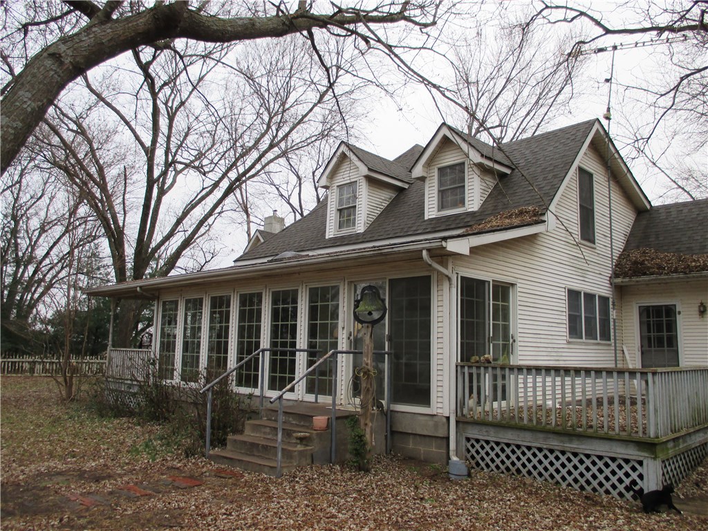 Home, barn & shop on 40 acres+/-, paved county rd.! Beautiful country setting, historic farm house renovated & updated thru the years & well built, featuring southern front sun porch & storm shelter area. (hm needs tlc). Forty acres, public water tap & 2 wells, public gas & mature shade trees. Awesome barn & shop w/concrete floor ! View of the 40 acres from yard. Convenient to XNA & Wal-Mart distribution center & fire station! Will consider property split. Motivated!!