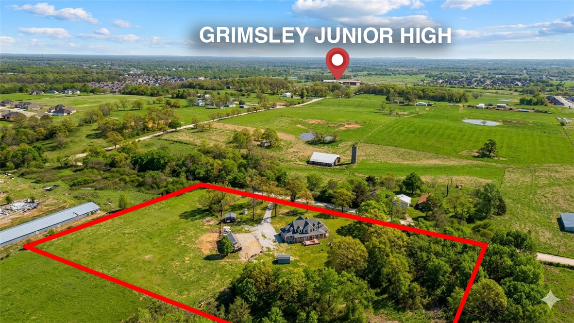 Rare 5-acre opportunity just minutes from town! This flat, fully fenced property offers endless possibilities—ideal as a horse hobby farm, private country retreat, or future development investment. The 4-bedroom home features an office, sunroom, formal dining, and wraparound porch with stunning views. Major updates: roof (2022), A/C units (2021 & 2023), and water heater (2017). Also listed as land (MLS #1348354).