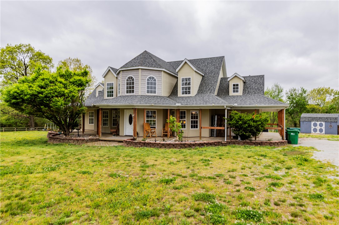 Rare 5-acre opportunity just minutes from town! This flat, fully fenced property offers endless possibilities—ideal as a horse hobby farm, private country retreat, or future development investment. The 4-bedroom home features an office, sunroom, formal dining, and wraparound porch with stunning views. Major updates: roof (2022), A/C units (2021 & 2023), and water heater (2017). Also listed as land (MLS #1348354).