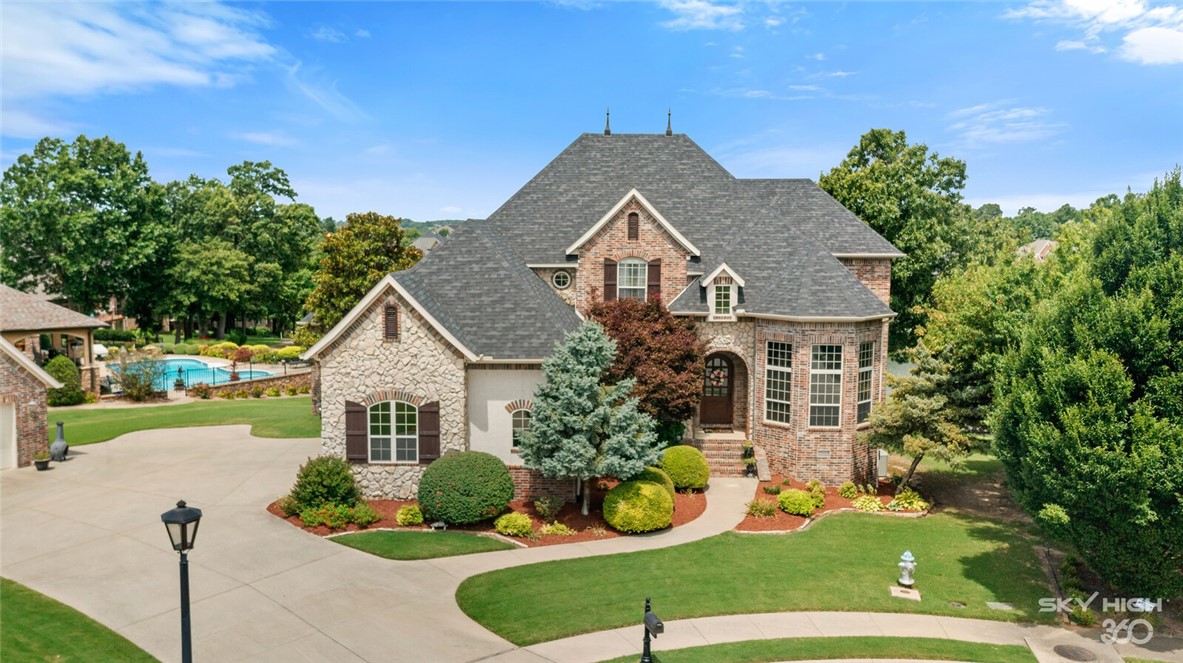 The most spectacular sunsets in the neighborhood are seen from this home overlooking hole No. 2 fairway and Waterfall Lake of the Shadow Valley Country Club Golf Course and Community! This beautiful and spacious home provides three levels with 6 bedrooms, 5.5 bathrooms, large master closet, mudroom, oversized laundry room, parlor room, study, walkout basement, workout room, 4 (yes FOUR) car garage, and MORE! This is a must-see with Golf Membership Included! Country Club amenities: 40,000 Square Foot Clubhouse, Championship 18 Hole Golf Course, Tennis Center, Fitness Center, Overlook Restaurant and Full Service Bar, Children's Activity Center, Swim Center, Playgrounds, Basketball Courts, Acres of Green Space, Lake and Osage Creek Fishing, Walking and Jogging Trails, Athletic Fields.
Golf Membership included!