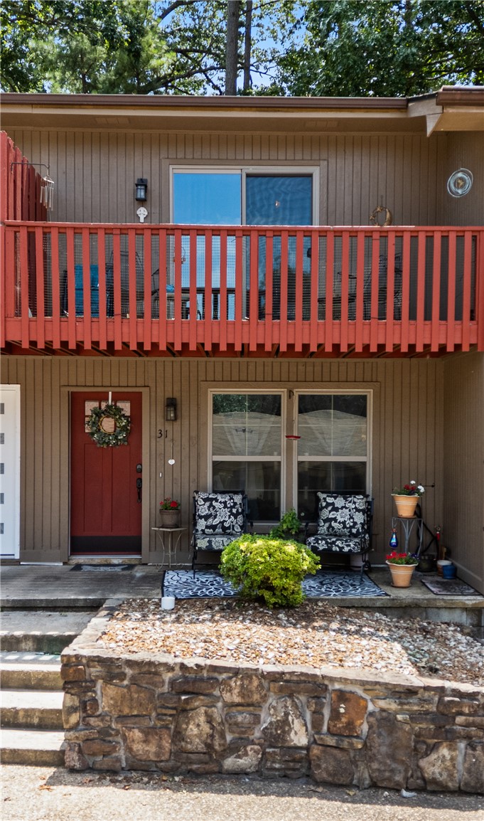 Lovely two bedroom/1.5 baths townhome in Bella Vista, situated near golf courses, trails, and other recreational amenities offered by the community. The main level features a spacious living room with an electrical fireplace that changes color for ambiance, a kitchen and dining area, as well as a half bath. The upstairs features two bedrooms with spacious closest, a balcony, washer and dryer that conveys as well as the master bath situated conveniently between the two bedrooms. The townhouse has a newer roof and gutters, newer HVAC system/ water heater, new pressure assist toilet, a new electrical panel and the sewer line was cleaned, coated and descaled in 2022.