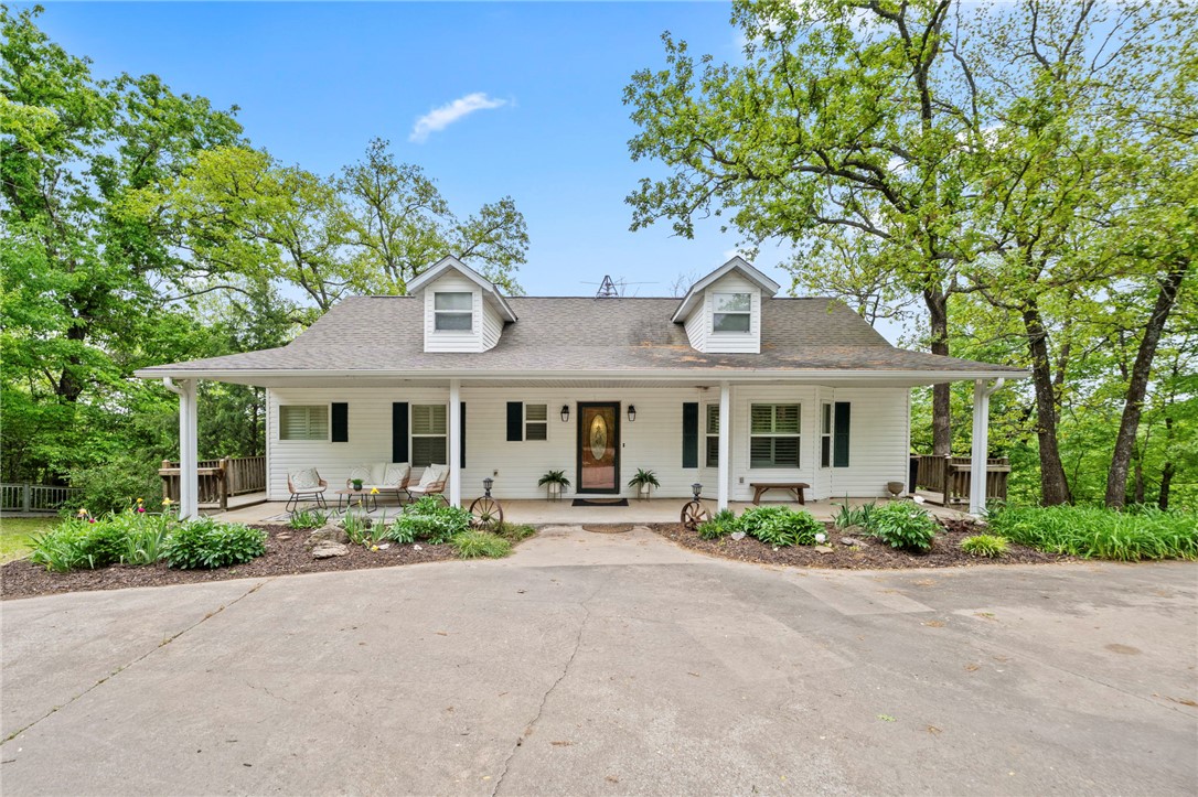 Enjoy private riverfront living on 7 secluded acres with direct water access and sweeping views. This fully renovated 3-bed, 3-bath home offers 2,704 sq ft of move-in-ready living with fresh interior paint of walls and trim, doors and new hardware, new carpet, LED lighting, updated light & plumbing fixtures throughout, and exterior ceiling fans for outdoor living comfort. The open-plan kitchen features a central island, quartz countertops, subway-tile backsplash, & all-new stainless appliances including range, dishwasher, side-by-side refrigerator & beverage fridge—perfect for entertaining. Updated primary bath is a spa-like retreat with double vanity, walk-in shower & large soaking tub w/whirlpool jets. Primary bedroom offers direct exterior access to deck for easy indoor-outdoor living. Walk out basement offers more indoor/outdoor space for family games & entertainment. 2 car detached garage/shop. Old trails down to water could be restored. Plenty of open ground for gardening & play. Rural Water coming soon.