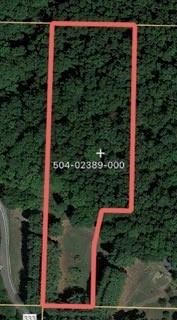 Beautiful 2.51 acres ready to build on, lots of pine and hardwood, So many options with this land.  Water and electric on site. Camping Trailer and Storage Building will convey to Buyer at Closing as a gift. Property is at the top of the mountain/end of the road on Trammel mt road, 1 mile of dirt road from Goshen Tuttle rd.