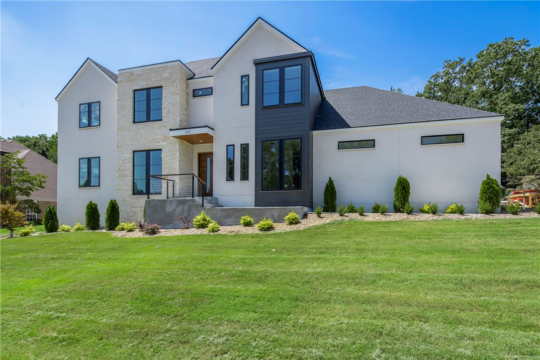 Modern elegance meets traditional design in this NEW CONSTRUCTION home by Dwellings. Nestled on almost ½ an acre within the highly coveted Heathrow subdivision in north Bentonville, this exceptional home seamlessly blends contemporary design with traditional charm. As you enter through the custom wood front door you’re greeted with soaring ceilings with an abundance of natural light. Custom cabinets & built-ins, hidden storage, well-thought-out design, and flow will instantly make you feel right at home. With too many details to list, including an in-ground pool w/ fountains, tanning ledge & heat pump, 3-car garage, home office, smart home technology & energy-efficient features, this is the perfect family home. The Razorback Greenway is right around the corner & all Bentonville has to offer is just right up the road. Don't miss this opportunity to own this exquisite RARE FIND! Schedule a showing today to experience the excellence of luxury living and make this dream home your reality! ATTACHED FEATURE SHEET.