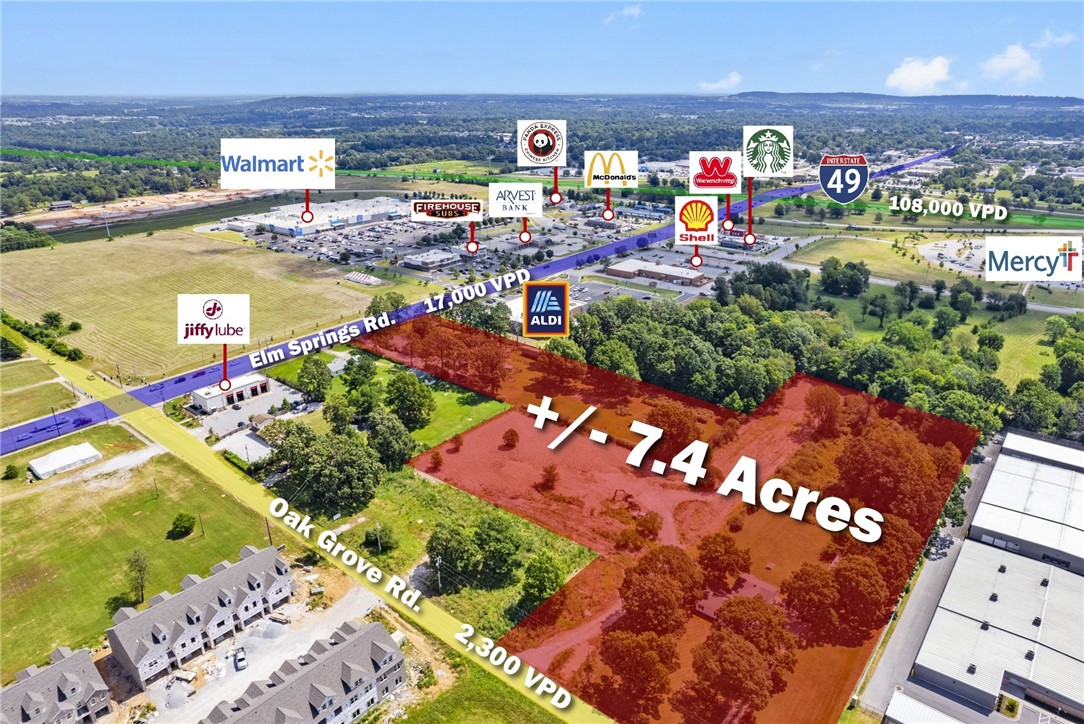 Prime development opportunity! +/- 7.4 Acres of level, partially wooded land just a half mile away from I-49 which sees around 108,000 VPD! This piece of land is strategically located near one of the busiest Walmart Supercenters, considered a "Test Store" and surrounded by excellent neighboring businesses, including Aldi, Arvest Bank, Starbucks, Firehouse Subs, a Shell Gas Station, and more. These businesses help provide a solid local demographic and potential customer base. 169' road frontage along Elm Springs Rd., which sees around 17,000 VPD and 238' road frontage along Oak Grove Rd., which sees around 2,300 VPD. Currently zoned A-1, offering flexibility for various development possibilities. Don't miss out on this ideal site for your next project!