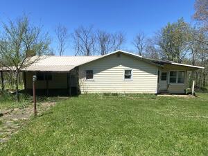 Fixer upper with 2 BR, 1 BA, 1,271 sqft, home on 1 acre, with metal roof, rural water, and no restrictions. Selling AS IS/Where Is.  5 Miles from downtown Jasper.