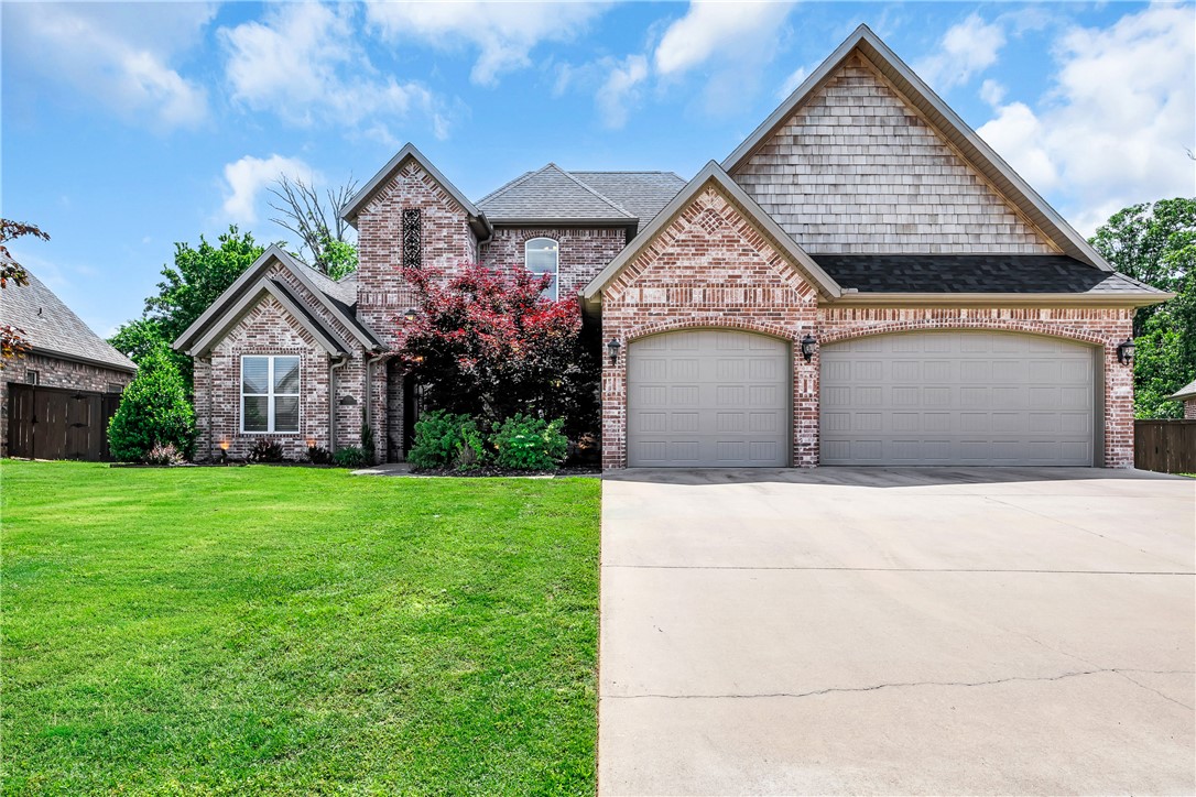 Imagine mornings picking fresh fruit from your own cherry, apple, or pear trees before walking to the community pool. Located in a quiet cul-de-sac close to downtown Bentonville and the new WalMart campus, this stunning 5-bedroom, 4.5-bath retreat offers the perfect blend of comfort and intentional living — a main-level primary suite for effortless everyday life, a home office, a bonus media room for family movie nights, and a covered patio with a brick firepit made for lingering evenings outdoors. Beautiful built-ins, a gas fireplace, and warm wood floors set the tone inside, while mature trees and full front-to-back irrigation complete the picture outside. Recent updates include a new roof, garage doors, and water heater (2024), carpet, upstairs paint, and microwave (2025), exterior lighting (2026), plus a new dishwasher and refrigerator that conveys — meaning you simply unpack and start living. Walkable trails, a playground, pavilion, and basketball courts round out this lifestyle-first community perfectly.