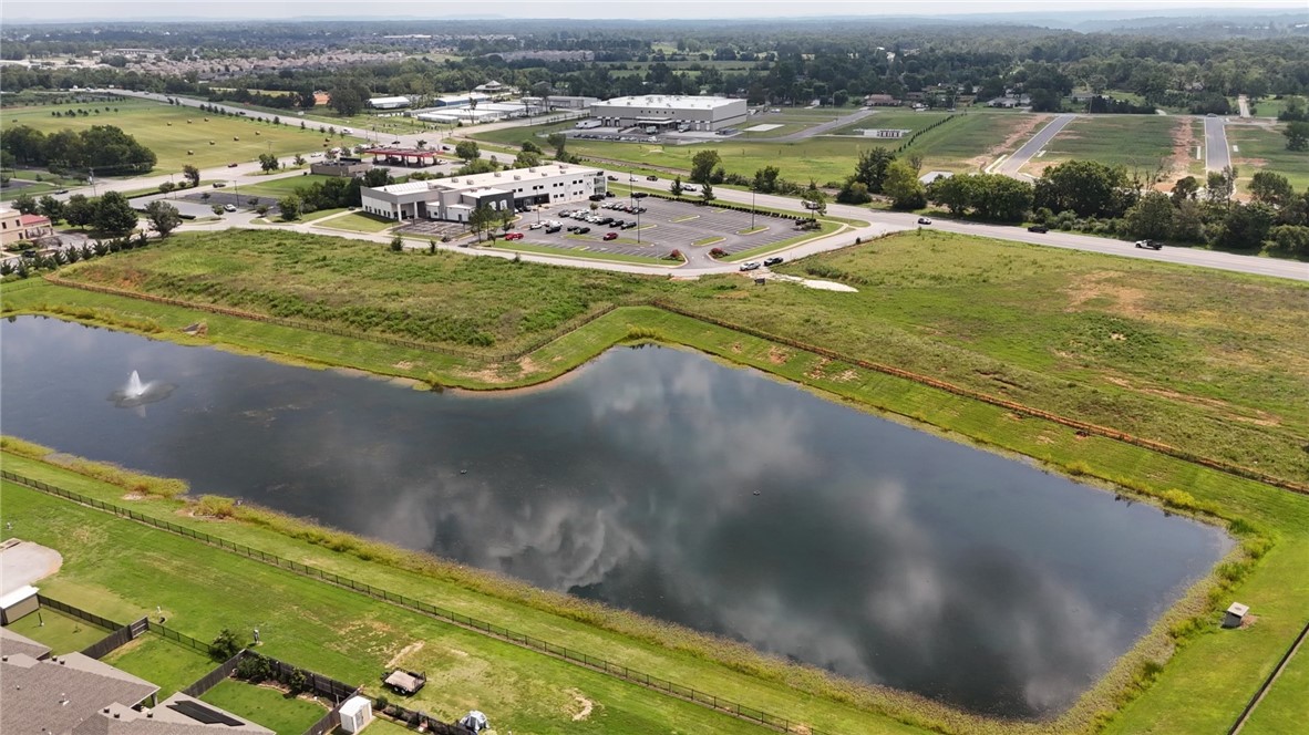 Wonderful opportunity to develop in this prime location just off of Pleasant Grove on the boarder of Rogers and Lowell in one of the fastest growing commercial areas. Located next to Fitness One with plenty of street frontage, utilities at the street, detention established to the west and ready for a multitude of possibilities.  May also be purchased with lot 190 giving an additional 3.87 acres.