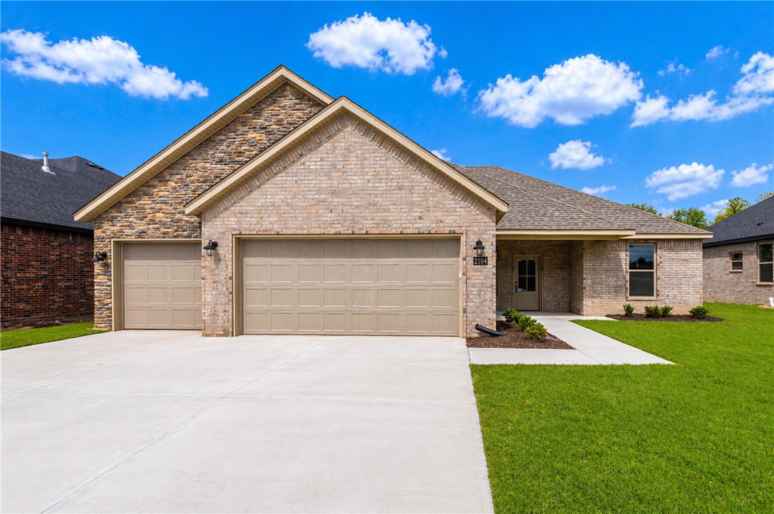 Welcome to this beautiful new construction home in Siloam Springs! This thoughtfully designed home offers a custom interior and exterior design of modern living space with quality finishes throughout. The exterior features classic brick construction, a 3 car garage, & an inviting curb appeal, while inside you’ll find luxury vinyl plank flooring, an open & functional layout, & abundant natural light. The kitchen is equipped with quartz countertops, energy star appliances, eat-in kitchen space, & ample cabinetry. Enjoy outdoor living on the patio. Don’t miss the opportunity to own this move-in-ready new construction home in a growing Siloam Springs neighborhood!