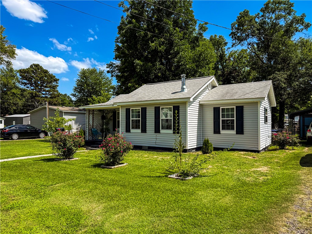 Charming and move-in ready, this well-maintained farmhouse offers 2 bedrooms, 1 bathroom, and 934 square feet of low-maintenance living. Durable vinyl siding and laminate flooring throughout make upkeep a breeze, while the bright, inviting interior feels warm and welcoming from the moment you walk in. Outside, a fenced backyard on a spacious 0.25-acre lot offers plenty of room to garden, entertain, or just relax. Perfect for first-time buyers, downsizers, or investors looking for a turnkey property!