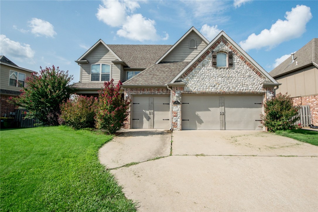 Lots of space in this great open floor plan 4 BR with 3 Car garage and big bonus room upstairs. First level features spacious eat-in kitchen open to living room, dining room, and 1/2 bath. Private master bed and bath with dual vanities, whirlpool tub, walk-in shower and big walk-in closet. Three bedrooms, full bath,  bonus room, and desk nook upstairs. Large fenced backyard with covered deck. Super location just off Don Tyson near schools, 71 B, and a quick drive to I-49.