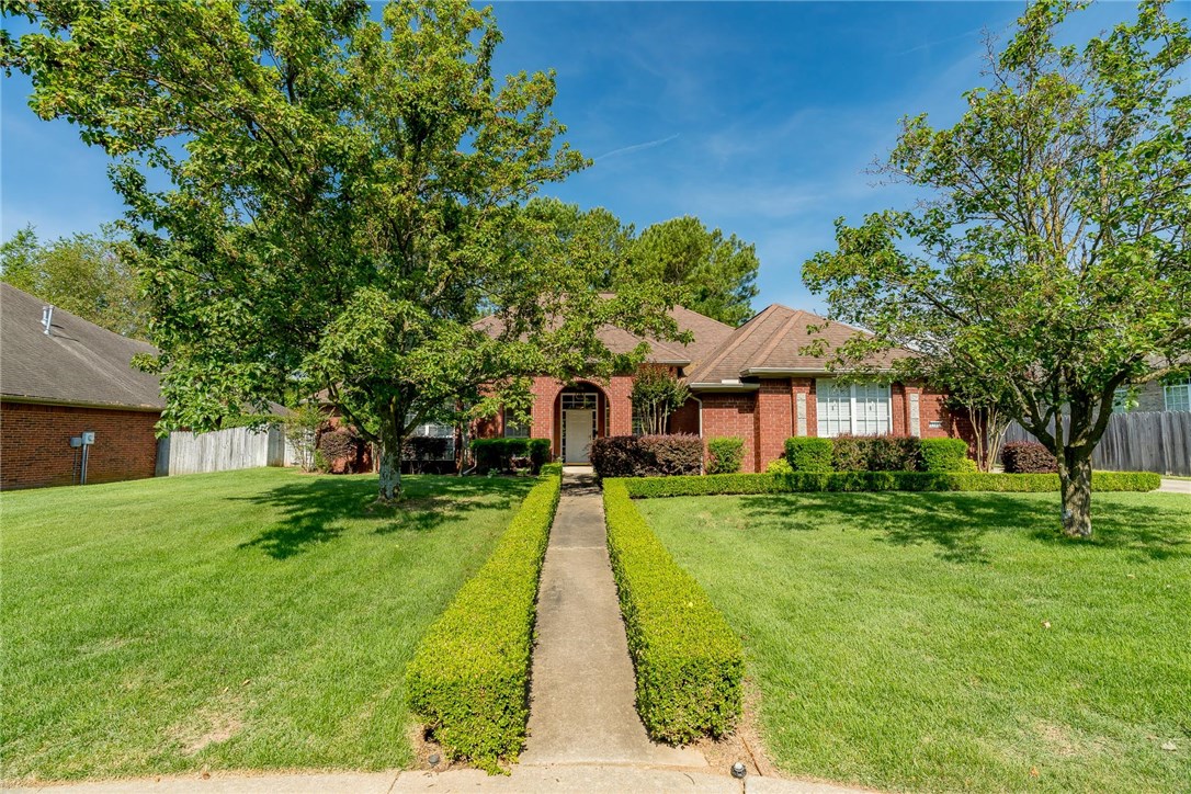 Awesome NE Fayetteville location! Easy access to the Niokaska & Mud Creek trails that lead to the Razorback Greenway Trail.  3br-2.5ba-3 car side entry garage home is all on one level! Spacious rooms.  2 living spaces; den with 2 skylights for natural lighting & living room with fireplace & built-ins. Formal dining area. Kitchen with solid surface counter-tops, double oven, glass top range, island & pantry - kitchen opens into the den area - great for entertaining.  Spacious master suite has separate patio entrance (with decorative glass over the door), double vanity, large walk-in closet, walk-in shower & whirlpool tub. Jack & Jill bath for the 2nd & 3rd bedrooms. 1/2 bath for guests. Hardwood & tile flooring throughout.  Large cover back patio for a nice outdoor living space. Super convenient location for shopping, elementary school, I49 and everything Fayetteville has to offer!