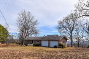 Spectacular Ozark view from this neat 3BR 2 1/2 BA home on 31 acres.  Large stone fireplace accentuates the living room with a wall of windows to take in the view!  Small den or office.  One level living! Acreage is mostly wooded for hunting with 3 small pastures for your animals.  4 bay metal garage and storage shed. Fronts paved road within 15 minutes of Crooked Creek and 45 minutes of Bull Shoals Lake, White and Buffalo Rivers, Harrison & Mt. Home, Arkansas.  Hunting, fishing, swimming, boating, hiking and camping opportunities abound.  A great location to enjoy the best of the Ozarks! All #'s and age approx.