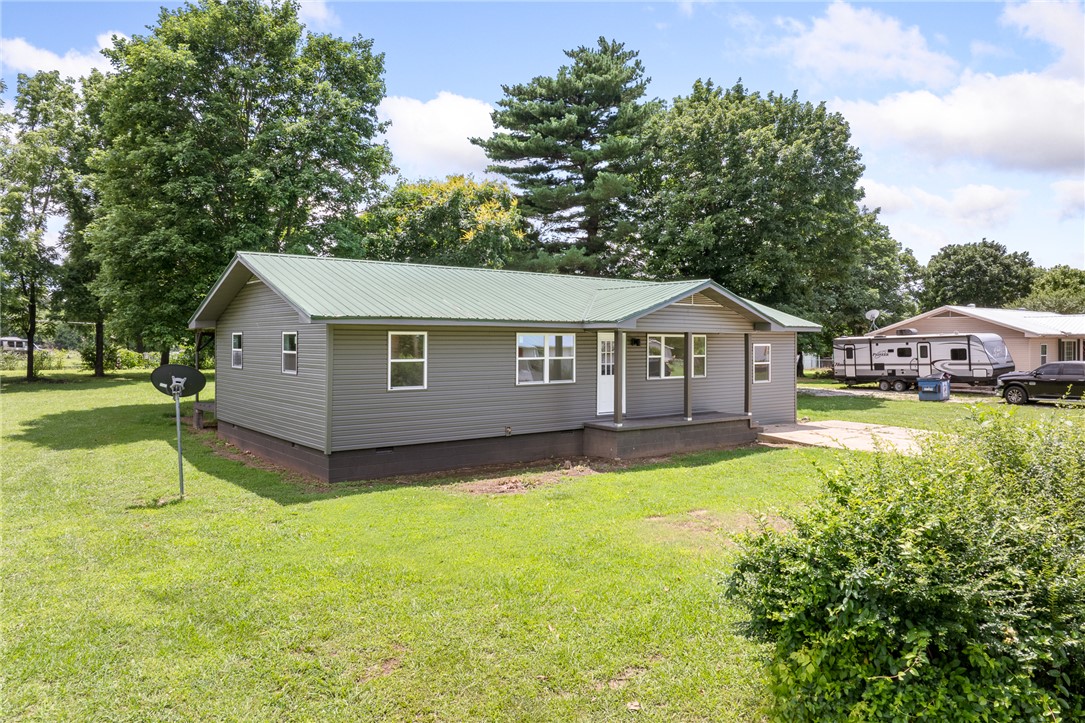 If you're looking for a place to put down roots, this one checks all the boxes!  This beautifully remodeled 4-bedroom, 2-bath home combines modern style with small-town charm. From the updated finishes to the thoughtful design touches throughout, there's nothing left to do but move in and enjoy. The spacious layout offers room for everyone, while the detached garage provides extra storage, workshop space, or a place to park your toys. Outside, you'll love the large, flat yard perfect for backyard games, gardening, pets, or simply relaxing under the Arkansas sky. Conveniently located just off Hwy 65, you'll enjoy an easy commute to Harrison while staying close to the outdoor adventures the Buffalo National River has to offer. Homes this move-in ready don't come along often, come see what life on Sue Street is all about!