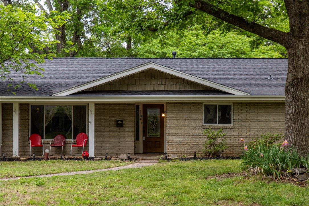 Welcome to a charming ranch-style home nestled on over three-fourths of an acre. This spacious one-level home features 4 bedrooms, 3 bathrooms, and more than 3,200 square feet of living space. Large rooms and multiple living areas create an ideal setting for both everyday living and entertaining, while the 400 sq. ft. sunroom and backyard provide an inviting space for the whole family to enjoy. The kitchen, primary bathroom, and utility room feature custom maple cabinetry and granite countertops. Extensive renovations completed in 2005–2006 blend vintage charm with modern updates, offering the perfect canvas to add your own personal style. Recent improvements include a brand new roof, new hot water heater, dishwasher, fireplace and chimney improvements, updated bathroom fixtures, and new carpet. Set among mature trees in an established neighborhood and located in close proximity to I-49, JB Hunt Park, and Downtown Springdale, this home presents an ideal blend of space and convenience.
