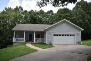 Relax on nearly 4 acres of manicured lawn with scattered trees; Home features 3 bedrooms and 2 full baths with hardwood floors and tile throughout; Shop building 24 x 24