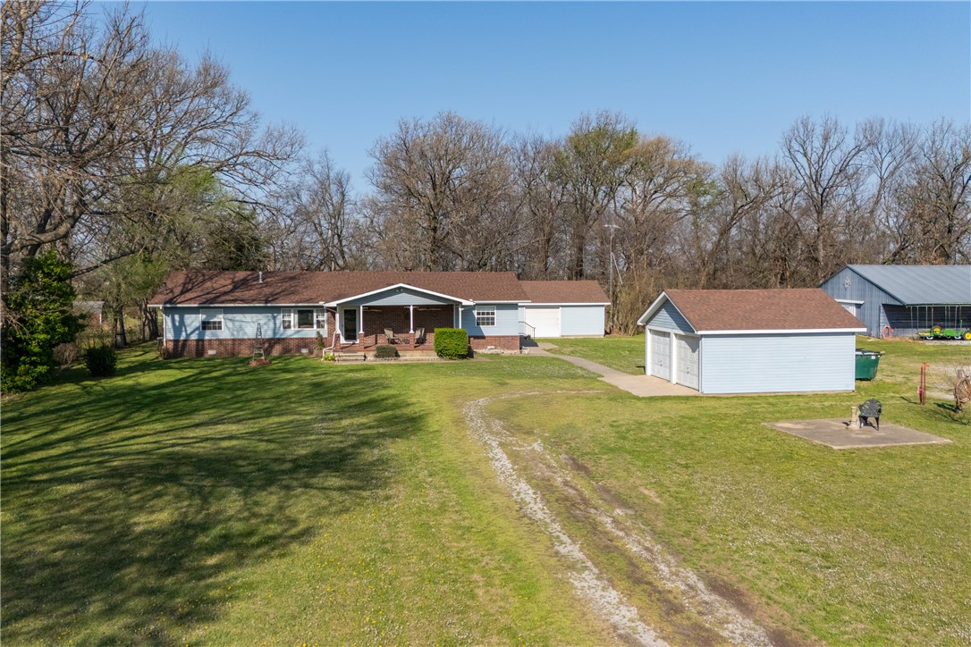 Step into your dream country lifestyle with this beautifully remodeled 2,048 sq. ft. home, featuring three spacious bedrooms and two modern full baths. Peace of mind comes standard thanks to a brand-new roof and high-end updates throughout the interior. For the entrepreneur or hobbyist, the property boasts a nice 32 x 44' professional shop—and the seller is even willing to include or sell the full suite of tools to jumpstart your home-based business.  Outdoor enthusiasts will love the functional barn and two detached garages, providing more than enough room for equipment, vehicles, and storage. The sprawling 5-acre fenced pasture is perfectly primed for a hobby farm, ready to welcome your horses or livestock. Whether you are looking to work from home, start a farm, or simply enjoy the quiet life, this versatile estate offers it all. Don't miss this rare opportunity to own a turnkey property that balances modern comfort with rugged utility.
