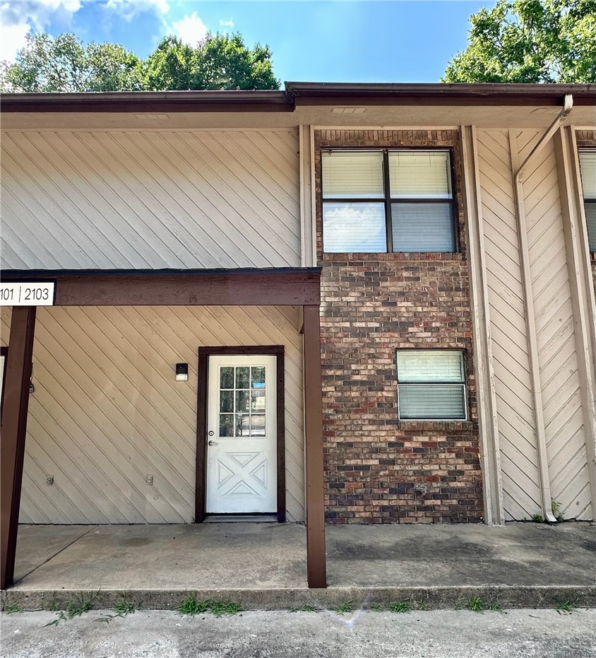 Just minutes from Gully Park and the Razorback Greenway trail, this beautifully updated 2-bed, 1.5-bath townhome is an exceptional investment opportunity! Nestled in East Fayetteville close to shopping and dining, and located only 3.5 miles from UofA campus and downtown, you'll enjoy quick access to everything Fayetteville has to offer. This home has been updated with a newer roof, flooring, paint, granite countertops, refinished cabinets, and lighting & plumbing fixtures throughout. The kitchen comes complete with newer appliances—including the refrigerator & washer/ dryer. Listing is for the single townhome unit. Tenant occupied (do not disturb). The other 3 adjoining townhome units 2101, 2105, & 2107 N East Oaks Dr are also for sale separately, see ML# 1354514, 1354522, and 1354526 respectively. 2101 N East Oaks Dr is available for showings.