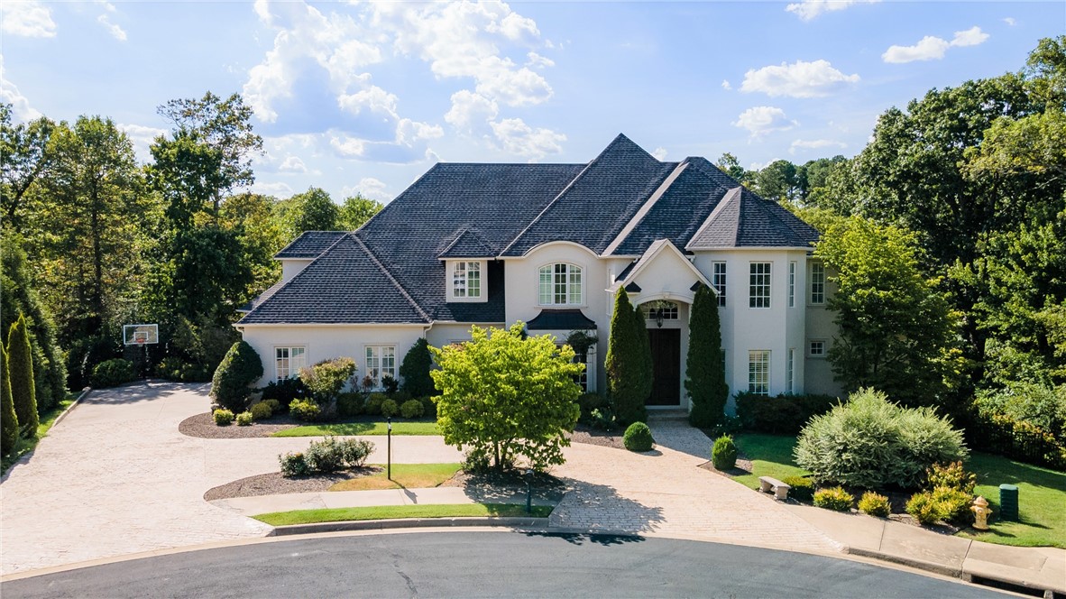 STUNNING 5 bedroom home on Blessings Golf Course in gated Clear Creek subdivision. Amazing views of the 12th and 13th fairways and the charming wood cart path bridge. Amenities galore include Formal Living Room, Dining Room, Office, Bonus Room, Playroom, Exercise Room, 5 Full Baths, 2 half baths, and all bedrooms feature en suites. Stunning gourmet Chef's Kitchen remodel by distinguished decorator. Kitchen features include granite and marble counter tops, 2 NEW dishwashers, trash compactor and 2 islands. Seller has completed many updates! Main level hardwood floors newly refinished. Elegant newly painted brick, cast stone and stucco exterior in 2022. Stamped concrete walkways nestled in beautiful mature landscaping. Custom built, one owner home with circle driveway and located in a Cul-De-Sac. All hardwood floors throughout except dining, entry, bonus room and baths. Enjoy endless opportunities for entertaining both in spacious interior and outdoors! Don't miss the opportunity to buy this spectacular property!