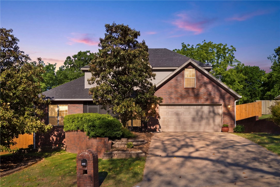 Step into this stunning all-brick corner lot home, perfectly situated in the heart of Fayetteville. This residence has been thoughtfully refreshed with designer paint and stylish LVP flooring throughout the main level and primary suite. The home is truly move-in ready, boasting a suite of recent upgrades including all-new stainless steel appliances, modern lighting and ceiling fans, and smart thermostats to name a few.

The main floor offers a spacious primary retreat, a versatile formal dining area (perfectly suited for a home office), and an open-concept kitchen that flows seamlessly into the light-filled living area. Upstairs, discover three comfortable guest bedrooms and a massive bonus room—ideal for a 5th bedroom, home theater, or play space.

Relax on the charming screened-in front porch or enjoy the large backyard featuring a newly installed privacy fence and beautiful mature landscaping.

Walking distance to Mud Creek Trail and minutes from Gulley Park, Lake Fayetteville, and Whole Foods.
