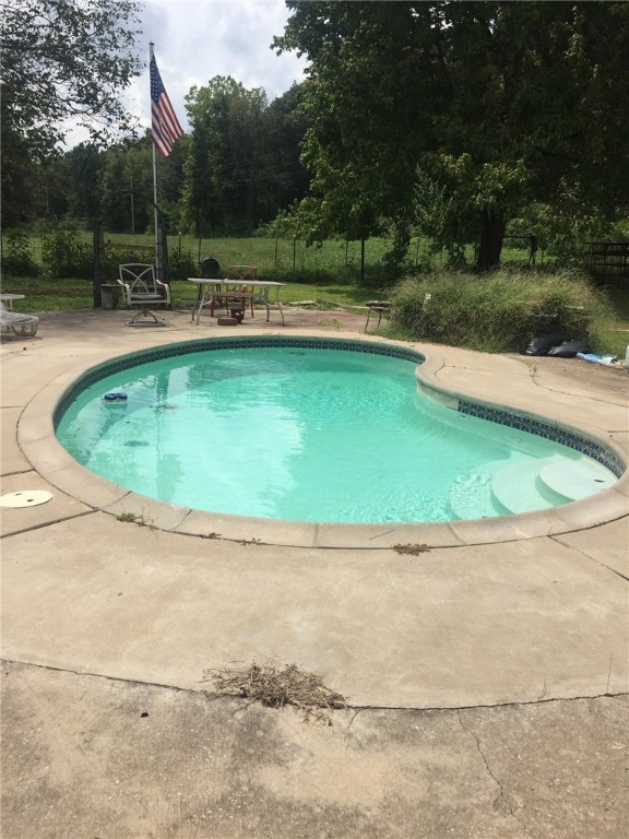 Located in the Dutch Mills community, this property is a nice little country setting to run a few cows, horses, or goats. Home has been take care of and updated throughout the years. New heating system in 2017, double pane windows in 2013, wood siding, and metal roof. Also, you can enjoy the in-ground pool in the summer with friends and family!