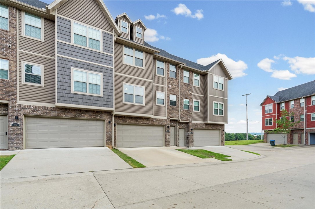 Move-In Ready Townhome in the Heart of Fayetteville!
Built in 2020, this beautifully maintained townhome blends modern style with everyday comfort. The open-concept floor plan creates a bright and inviting atmosphere.  With a spacious kitchen featuring stainless steel appliances, a large island, and seamless flow into the living area—perfect for entertaining or relaxing at home. Offering 2 bedrooms, 2.5 bathrooms, and an attached 2-car garage, this home is thoughtfully designed for convenience and low-maintenance living. This home is just minutes from University of Arkansas, shopping, dining, parks, trails and everything Fayetteville has to offer! Whether you're a first-time homebuyer, investor, or looking to downsize, this move-in-ready townhome is an exceptional opportunity.