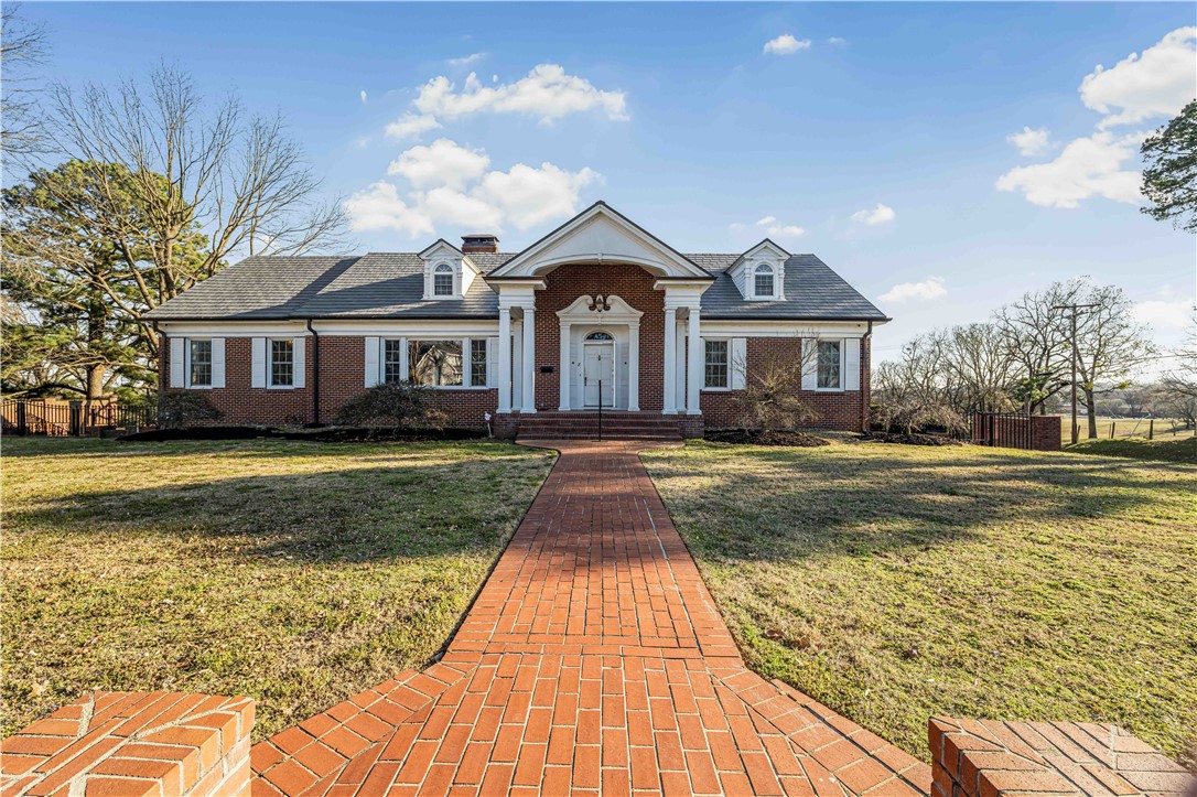 This 1956 legacy estate in the coveted Free Ferry Heights subdivision is ready for its next owner to write a new story.  Free Ferry is one of the most sought after areas in Fort Smith, known for its beautiful drives and some of the largest and most distinguished estates in the city.  Built in an era when. homes were designated to feel grand, this property showcases high-end millwork, crown molding, timeless chandeliers, granite counters and two stunning fireplaces.  The craftsmanship throughout reflects a time when details mattered and homes were built to impress.  Step inside and imagine a simpler time hen every room felt elegant and refined.  This remarkable estate now calls its next owner to bring new life and vision while honoring the beauty and craftsmanship of the past.
