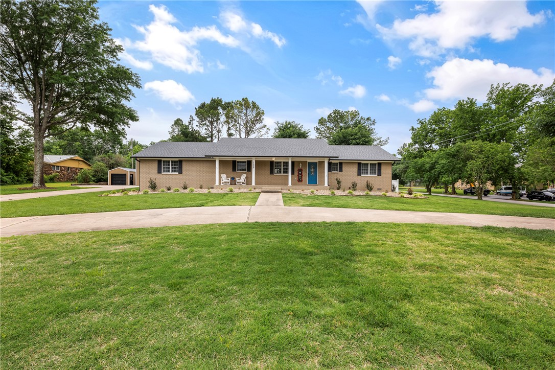Have you been looking for that one-level home that is both close to the Bentonville Square and trails, is on a 1 acre lot, and has a barn (16' x 42' with a 15'h x 12'w door)for your RV AND a workshop(21' x 12' w/ 9' x 7' door)?!?!  Well.....You found it!  Enjoy your morning coffee, grilling, or relaxing on the back patio or host a dinner party inside this meticulously cared for home.  In the middle of it all, it's ready for you to make it yours!