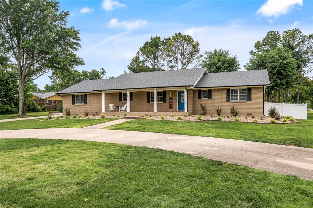 Have you been looking for that one-level home that is both close to the Bentonville Square and trails, is on a 1 acre lot, and has a barn (16' x 42' with a 15'h x 12'w door)for your RV AND a workshop(21' x 12' w/ 9' x 7' door)?!?!  Well.....You found it!  Enjoy your morning coffee, grilling, or relaxing on the back patio or host a dinner party inside this meticulously cared for home.  In the middle of it all, it's ready for you to make it yours!